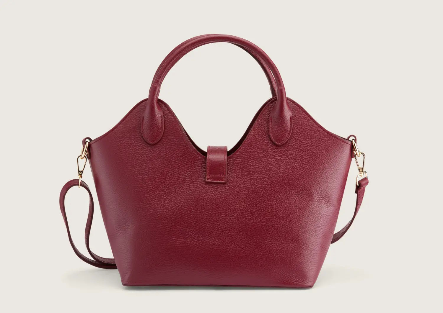 Back view of the dark red leather handbag featuring smooth leather texture and refined stitching.