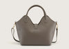 Back view of the grey leather handbag showcasing smooth leather texture and subtle stitching details.