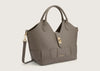 Elegant grey leather handbag with top handles and a structured silhouette.