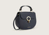 Stylish navy blue leather shoulder bag with adjustable strap and sleek minimalist design.