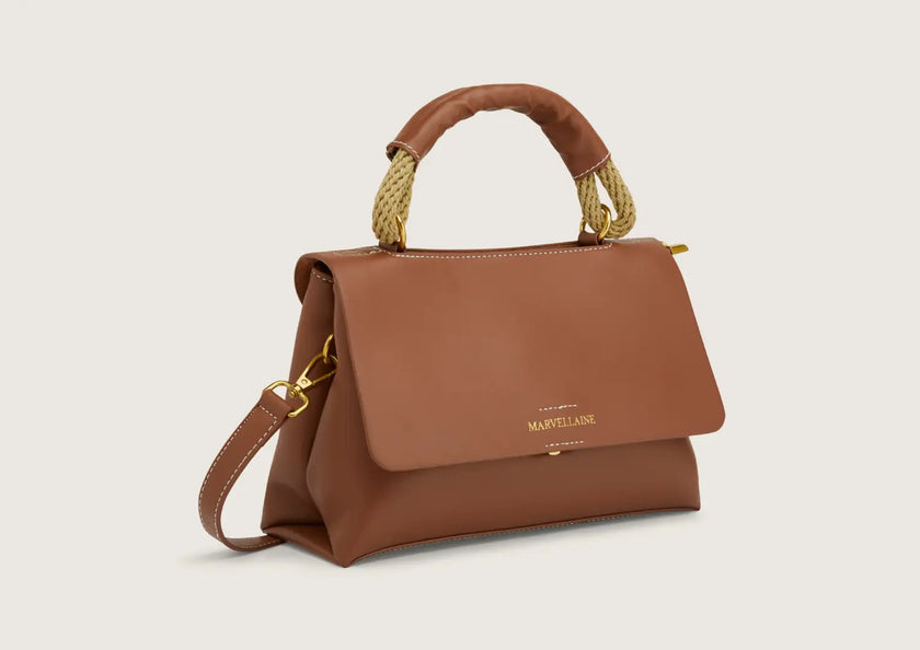 Front view of a premium leather crossbody bag with adjustable strap.